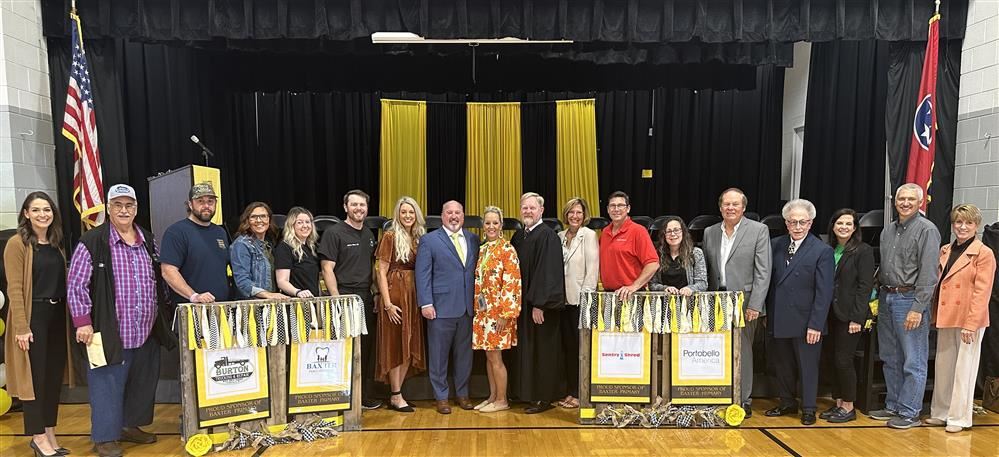  Four local businesses became official ‘adopters’ of the school during a recent ceremony.