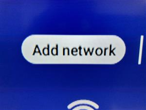 The rounded rectangle button to Add network.